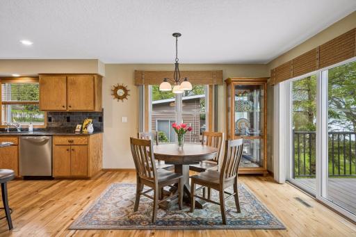 Enjoy peaceful views from the dining area with easy access to the spacious lakeside deck.