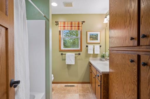 The full bath on the upper-level features abundant storage.