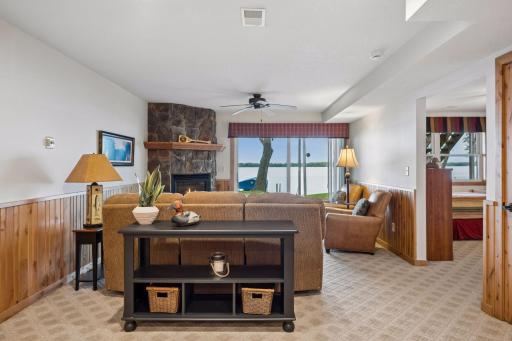 Expansive lower-level family room offers plenty of space for entertaining, relaxing, and hosting guests at the lake.