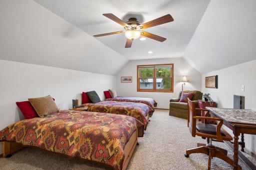 Large bunk-style sleeping room comfortably accommodates family and friends. This is a perfect space for hosting lake weekends and holiday gatherings.