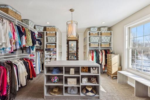brilliant primary closet, one of two in gorgeous primary suite
