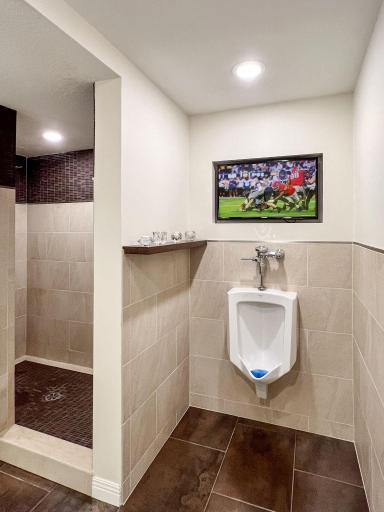 lower level, 3/4 bath is complete with urinal and TV