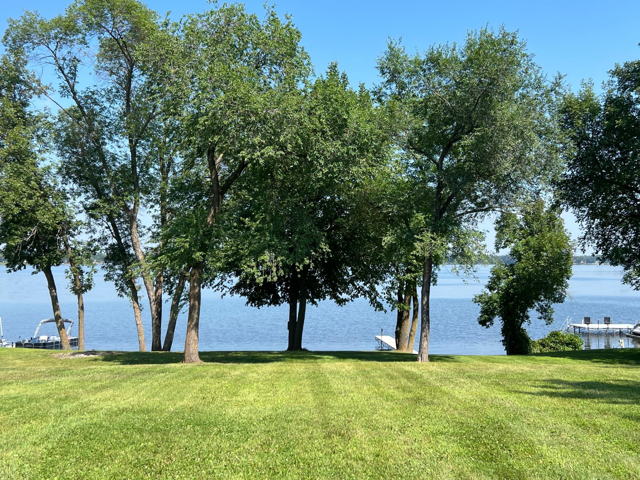 Mature trees near the water provide shade in the heat of summer..