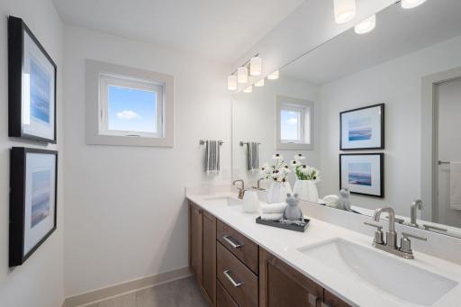 Upper-level main full bathroom with dual vanities