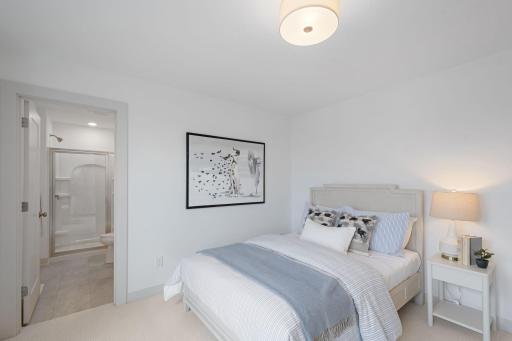 Upper-level bedroom 3 with walk-in closet and private 3/4 ensuite