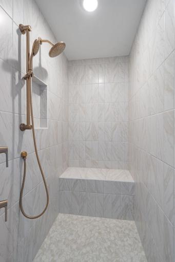 HUGE fully tiled walk-in shower with bench in primary ensuite