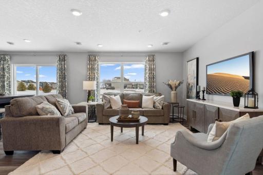 Spacious living room of this open concept main floor! Photo is of model home. Colors and options may vary. Ask Sales Agent for details.