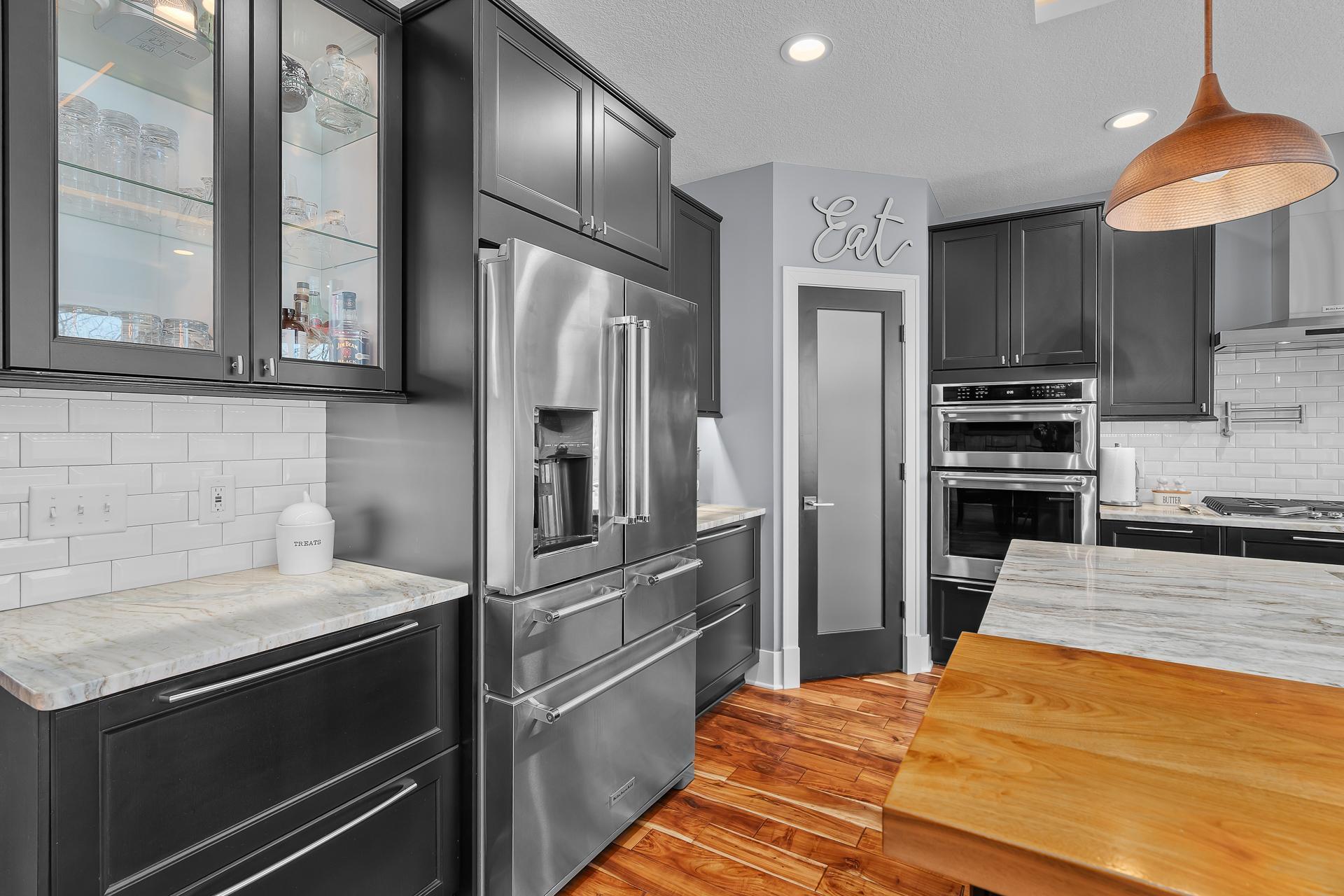 SST KitchenAid French Door refrigerator with 5 door configuration. Glass door display cabinet.