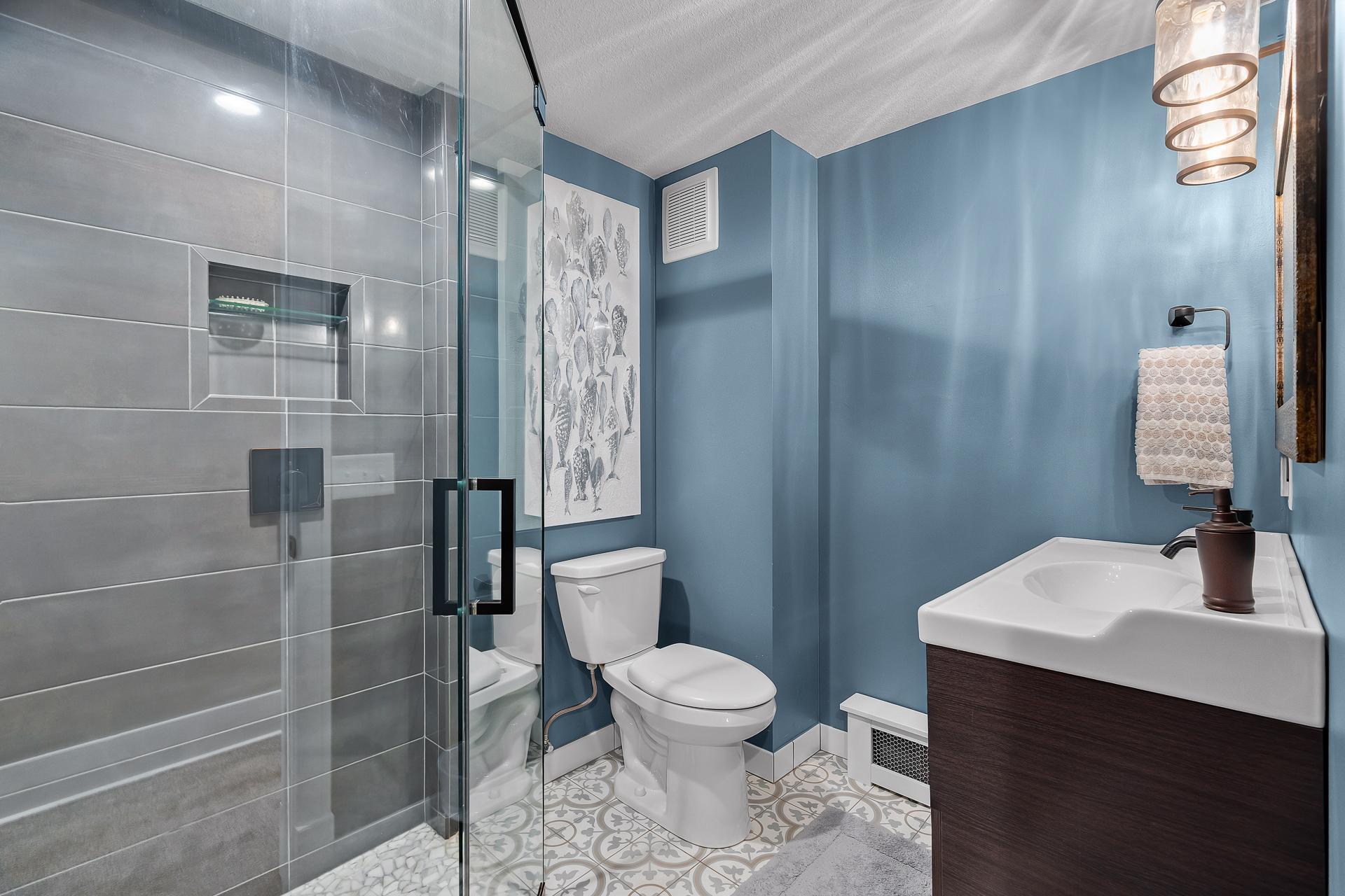 Lower level 3/4 bath with rain shower.