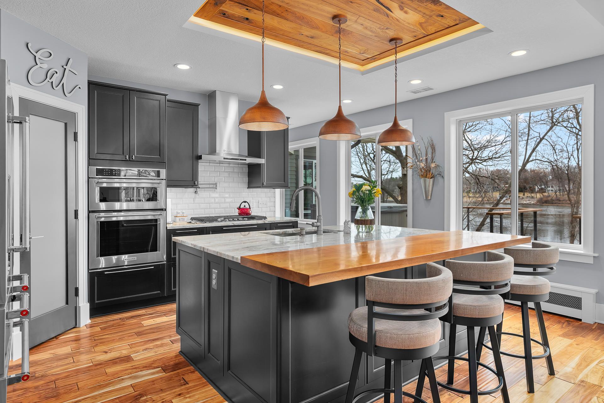 Don't miss the custom walnut box vault above the island with inset lighting.