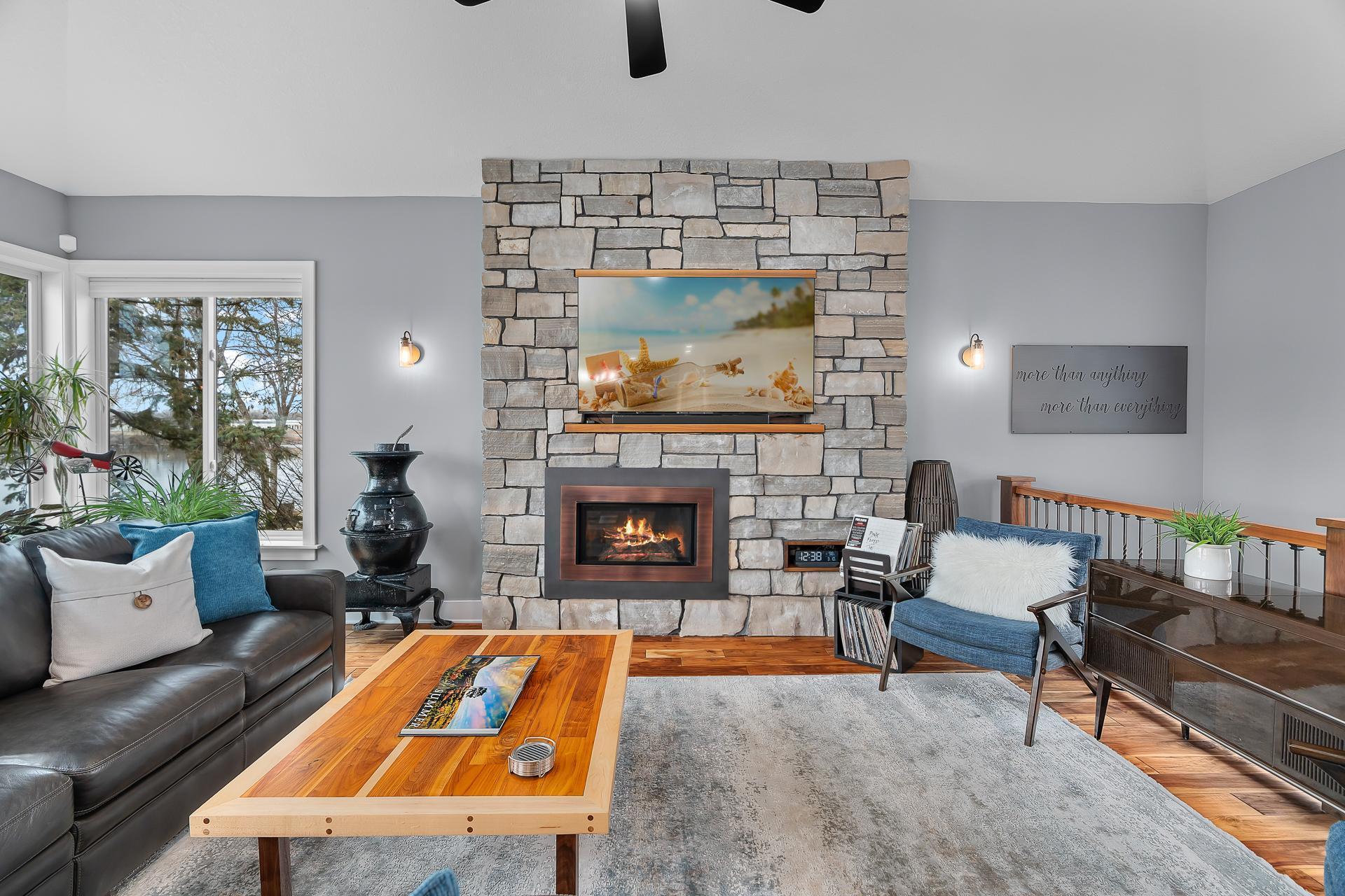 20x14 Living Room with gas fireplace insert and floor to ceiling stone surround.