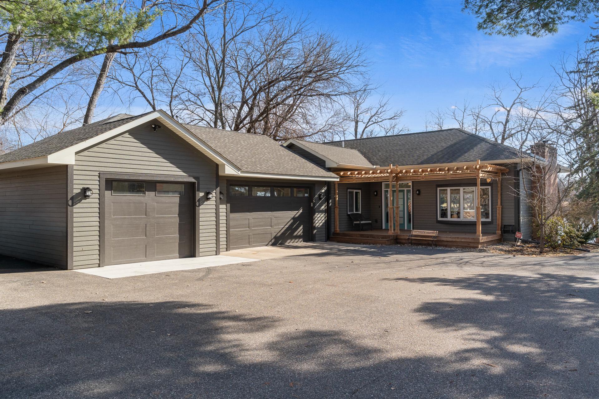 New 3-car garage 2024. 871 SF. 8 ft doors. Super insulated & heated. Upgraded wi-fi garage door openers. Upgraded cabinets & workbenches. Surround sound. Wired for AC.
