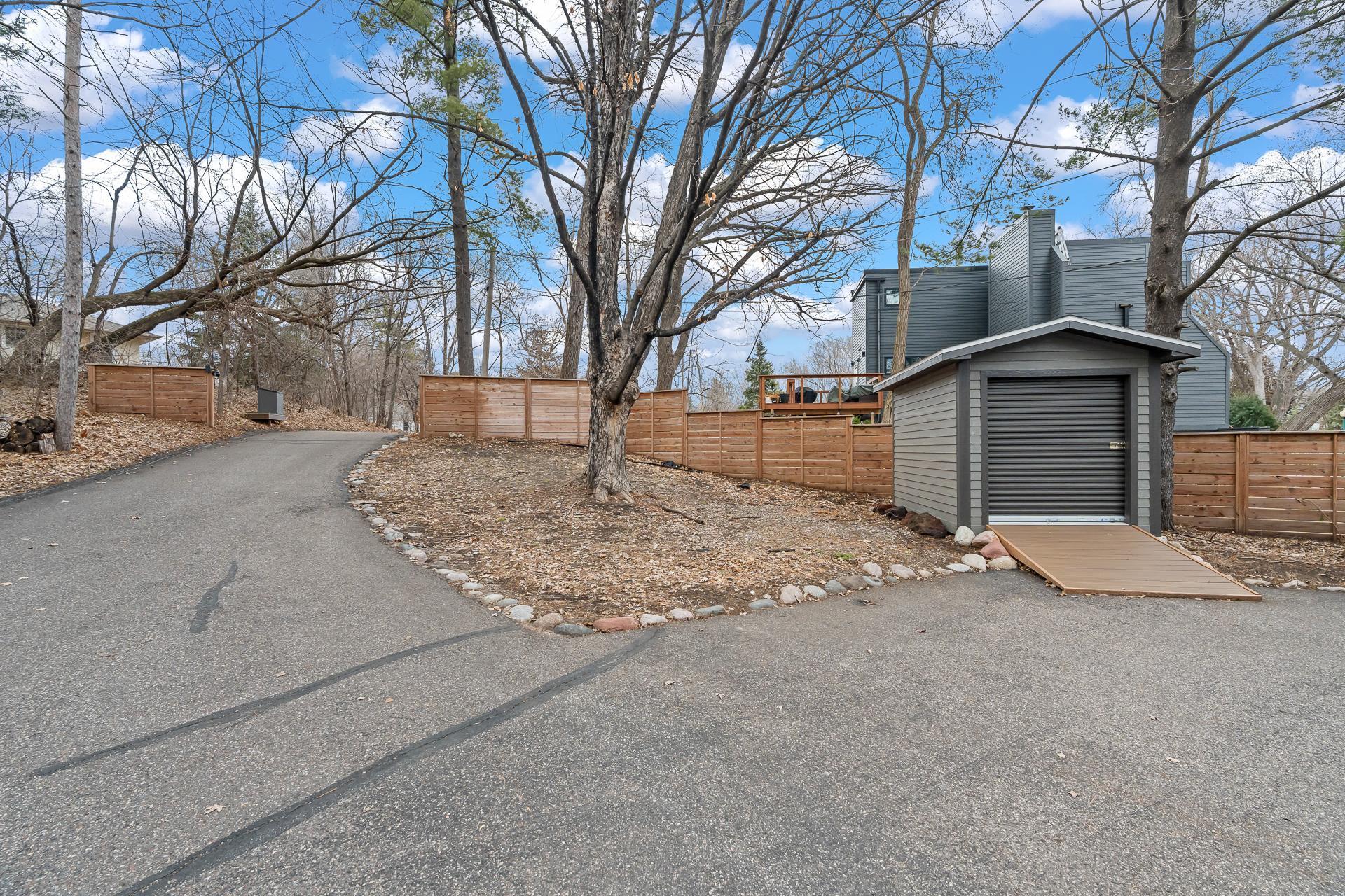 Private drive with privacy fencing.