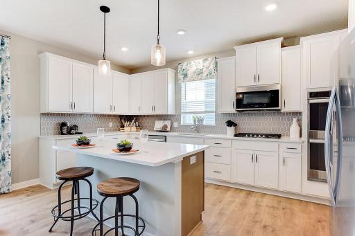 A different angle of this great center island that will be a quill color. All of our homes will have various color packages chosen by our amazing designers.