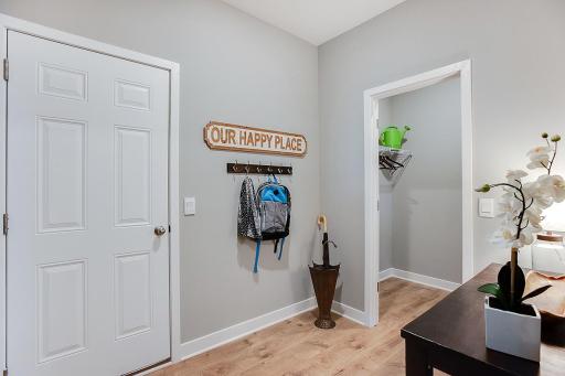 The owner's entrance off the garage is spacious. There is room for a bench and hooks, as well as a large walk in closet for all those sports bags and winter coats!