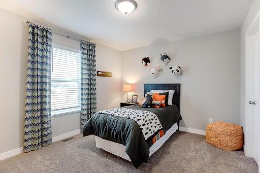 Each of the home's secondary bedrooms on the upper level come perfectly sized and all feature their own private walk-in closet.