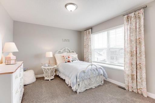 Each of the home's secondary bedrooms on the upper level come perfectly sized and all feature their own private walk-in closet.