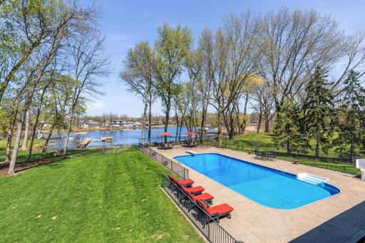 Home proudly sits on 210' of lakeshore on Lower Prior Lake. Inground pool boasts a diving board, newer liner, all other mechanicals under 3 years.
