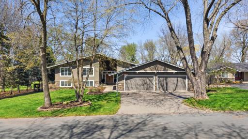 This Lower Prior Lake residence commands more than a shoreline. It delivers a way of life and is the total package.