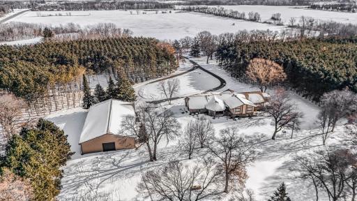 5,500+ sq ft custom-built with private retreat vibes — PLUS a 54' x 97' heated workshop and storage building just minutes to Sauk Rapids, St. Cloud and the surrounding areas with an easy commute to Mnpls/St Paul via Hwy 10.