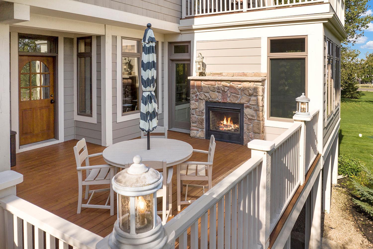 Refinished decking and full railings (2025), and stairs that lead down to the backyard.