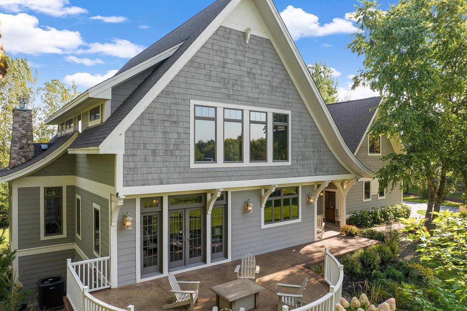 Curved stamped concrete patio at the front of the home, outside dining room making it perfect for a fire table and/or outdoor dining.