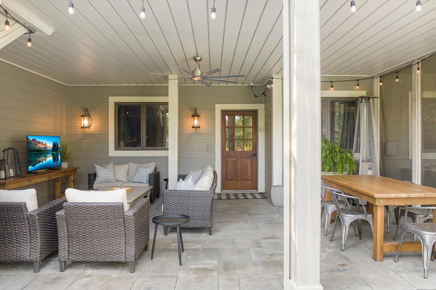 Huge patio: portion nearest the home is screened with premium Phantom retractable screens along the backyard & underdecking above…the remaining section of the patio is open air and connects to the backyard.