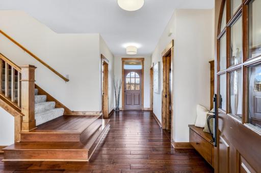 Main entrance. Rear door walks out to the deck. Beautiful & durable, hand-scraped hardwood flooring - flows consistently throughout much of the main level.