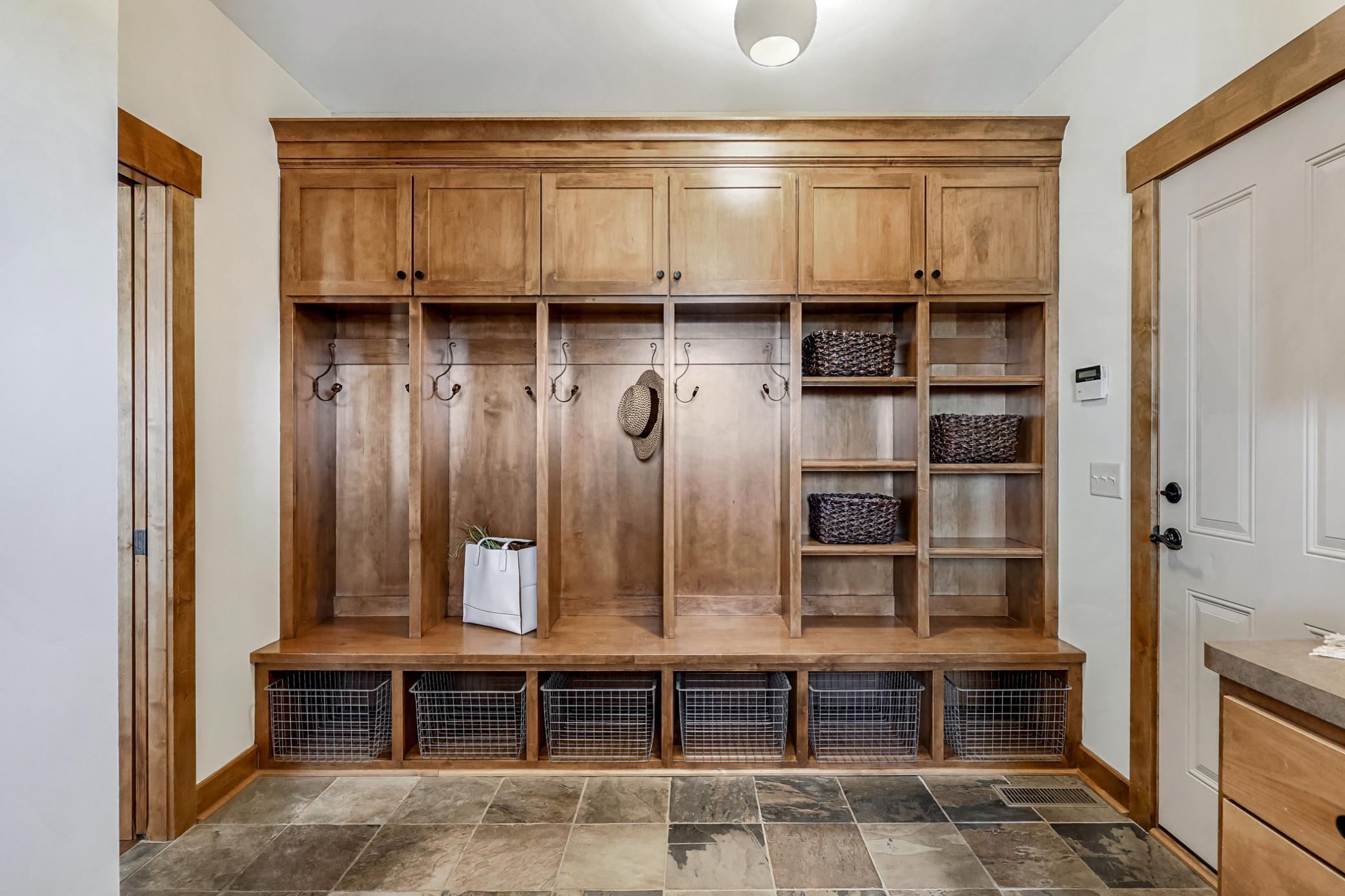 Custom lockers and cubbies with a mix of open and concealed storage options.