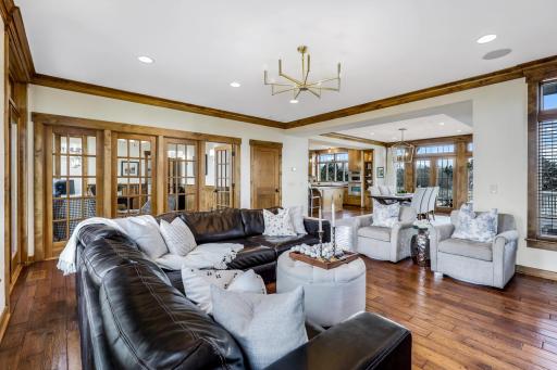 Amazing walls of windows & glass doors on multiple walls, one which overlooks the lush backyard & leads out to the 4-season porch, plus a wall of glass that looks into the office/flex space.