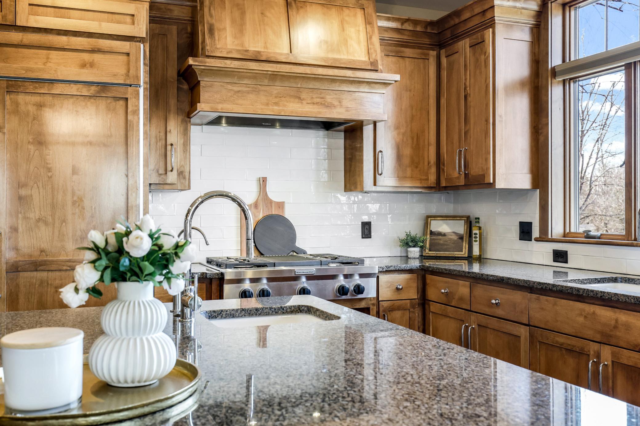 An abundance of granite counter space throughout with updated subway style backsplash.