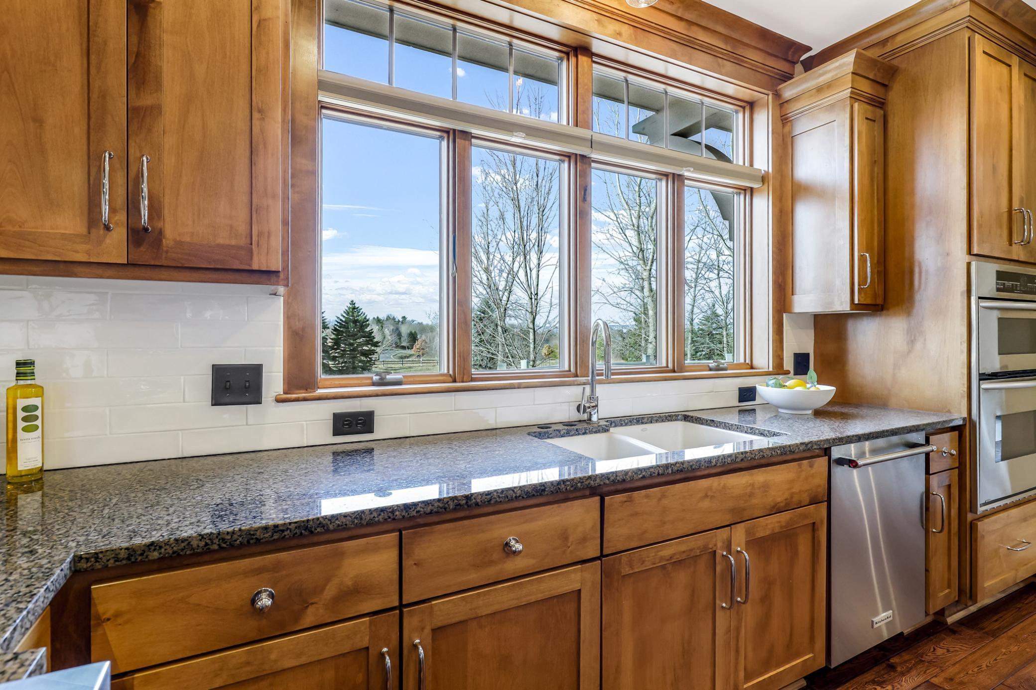 Stunning front yard views. Double porcelain sink. Stainless steel dishwasher.