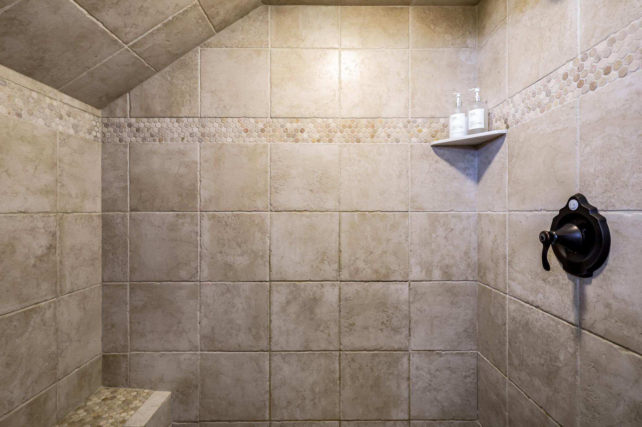 Private walk-in tile shower.