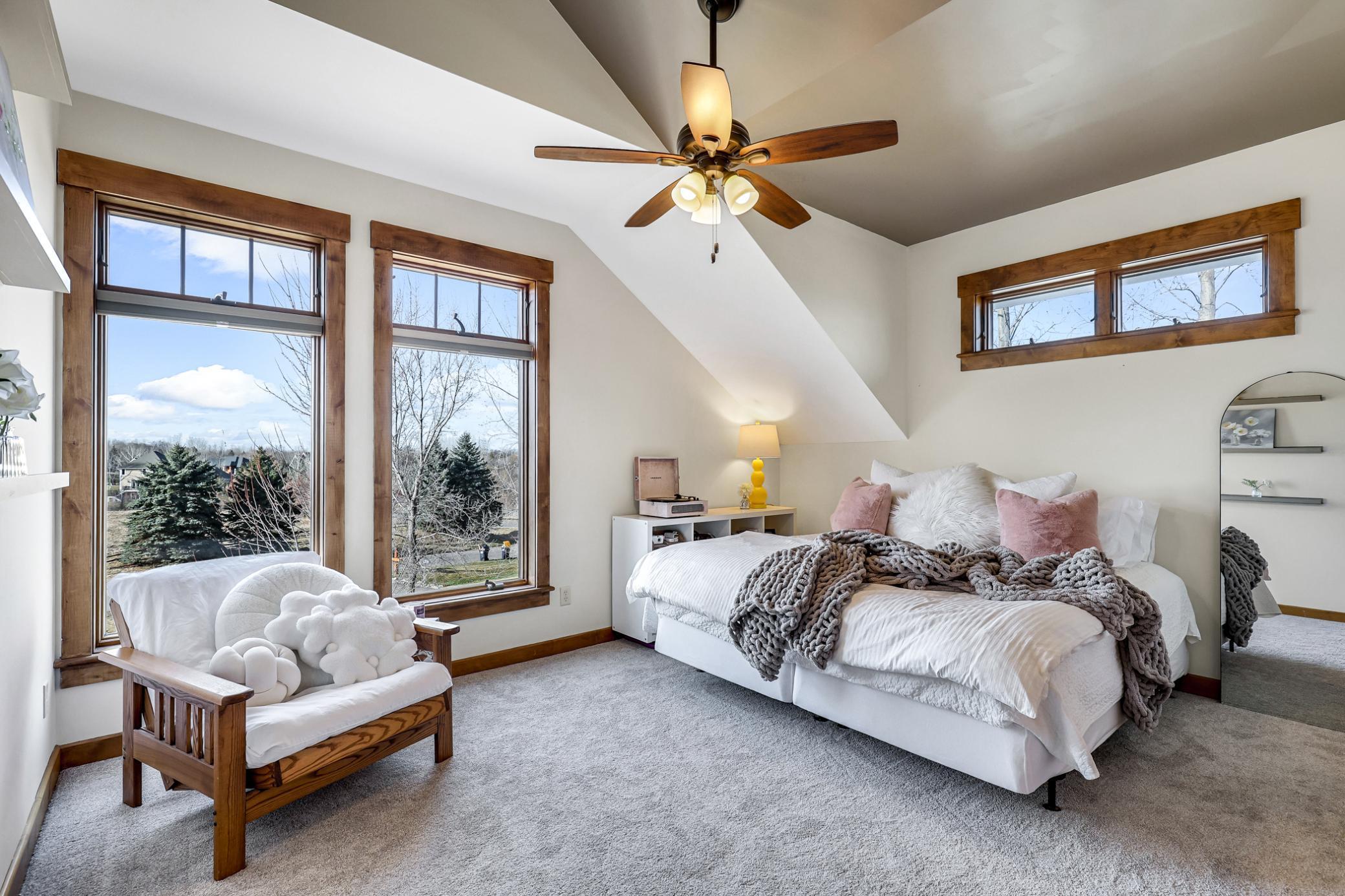 Side by side, the bedrooms are mirror images of each other, both spacious with vaulted ceilings, new carpet, large closets and oversized windows & transoms.