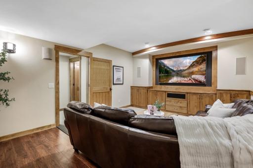 Space for plenty of seating, a media wall with built-in storage & a design which works with a large screened tv or projector set-up, plus built-in surround sound speakers.