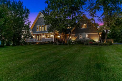 Spacious lot is surrounded by professionally landscaped perfection for the utmost in beauty & privacy.Picturesque landscaping includes several garden areas highlighted with a variety of perennials, trees, shrubs, and gorgeous limestone.