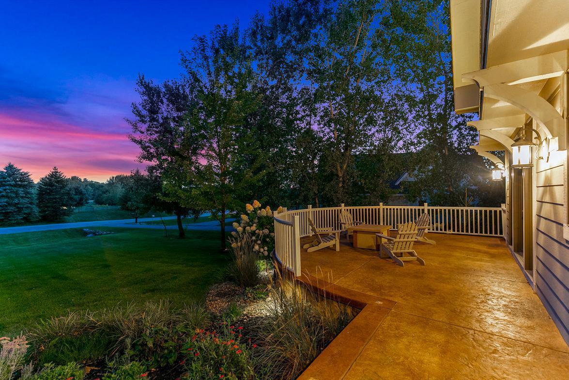 Curved stamped concrete patio at the front of the home, outside dining room making it perfect for a fire table and/or outdoor dining.