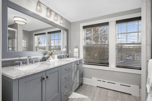A newer 3/4 bath on the 3rd floor with a double vanity.