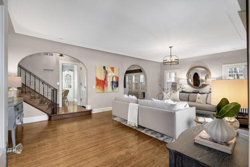 Beautiful classic interior details, including pretty millwork, arched windows, high ceilings and hardwood floors flowing throughout 3 floors.