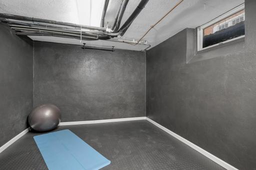 Lower level exercise room with rubber floor
