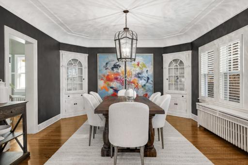 The banquet size Dining room has built-in corner cabinets and is wonderful for entertaining.
