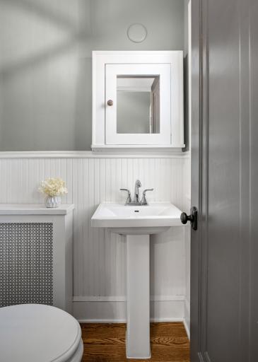 The Back hall has a big Pantry/ Mudroom, a cute powder room and access to the dog run BBQ patio.