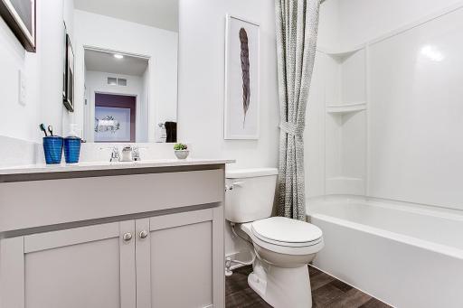 Hall bathroom on the upper level as well. *Model home, colors and selections will vary.