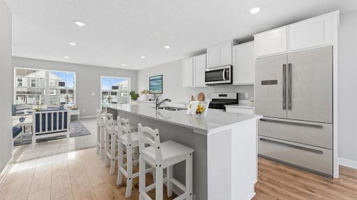 With a gas range, vented microwave fan, and large entertaining island, this kitchen is a chef's dream! *Model home, colors and selections will vary.