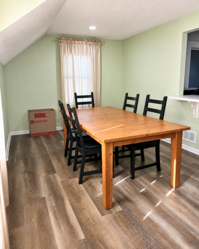 Dedicated dining room offers plenty of space to gather, with updated flooring and recessed lighting.