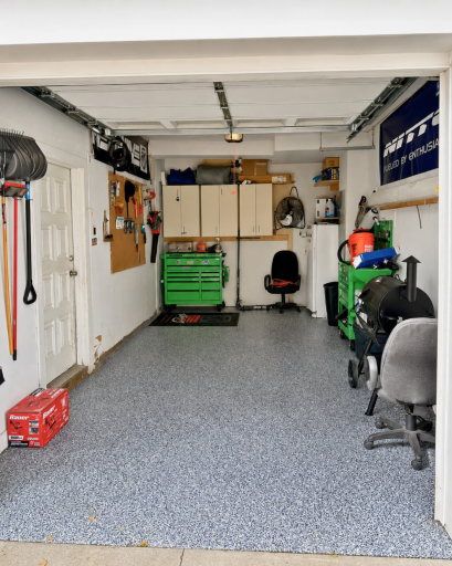 More than just parking, the garage offers excellent storage and workspace potential with an epoxy-coated floor. Freezer & cabinets to be excluded from the sale.