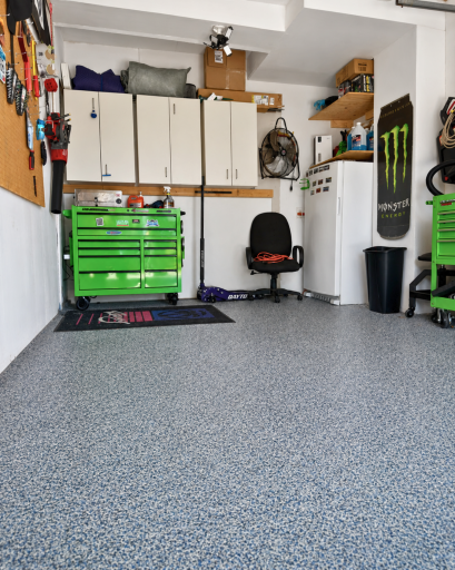 The attached garage features a professionally epoxy-coated floor for a clean, durable and easy-to-maintain finish. Freezer & cabinets to be excluded from the sale.
