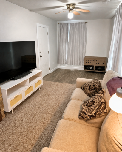 Multiple windows fill the main-floor living space with natural light, while the open layout provides flexibility for everyday living.