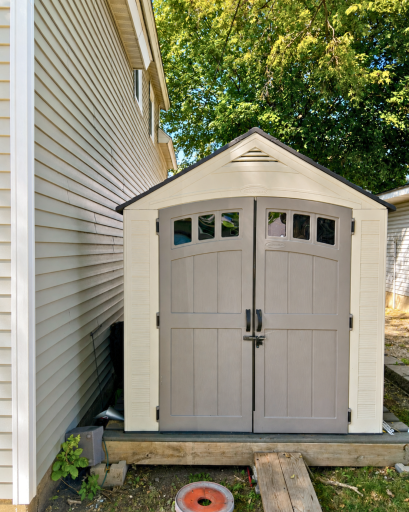 Extra outdoor storage is already covered with this 7' x 7' storage shed on an 8' x 8' platform, added in 2024.