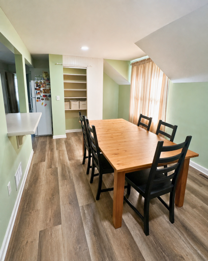 Dining room flows conveniently into the kitchen and features added pantry storage for everyday functionality.